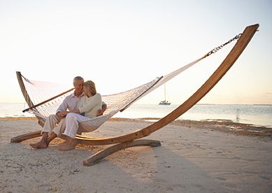 Man and woman on hammock on beach